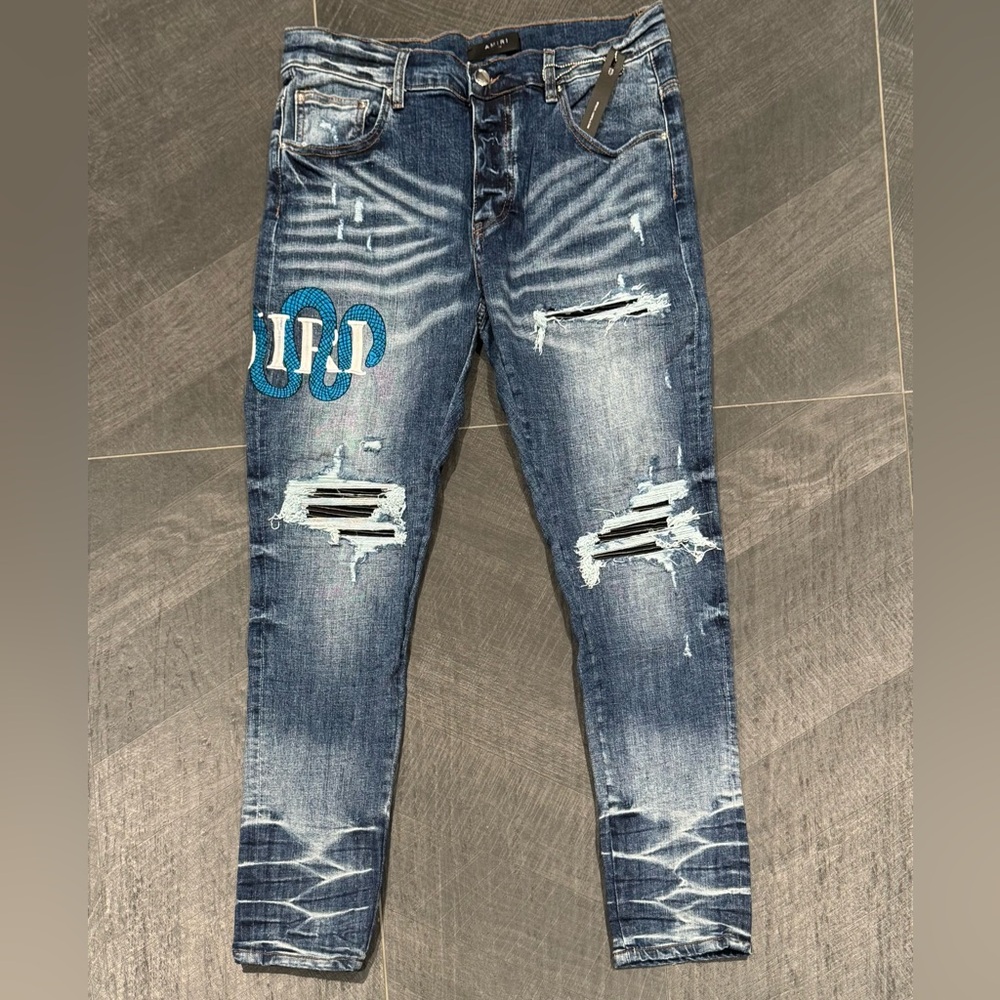 AMIRI Blue Distressed Skinny Jeans
